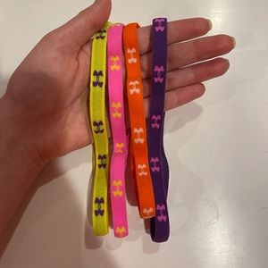 Four under armour headbands